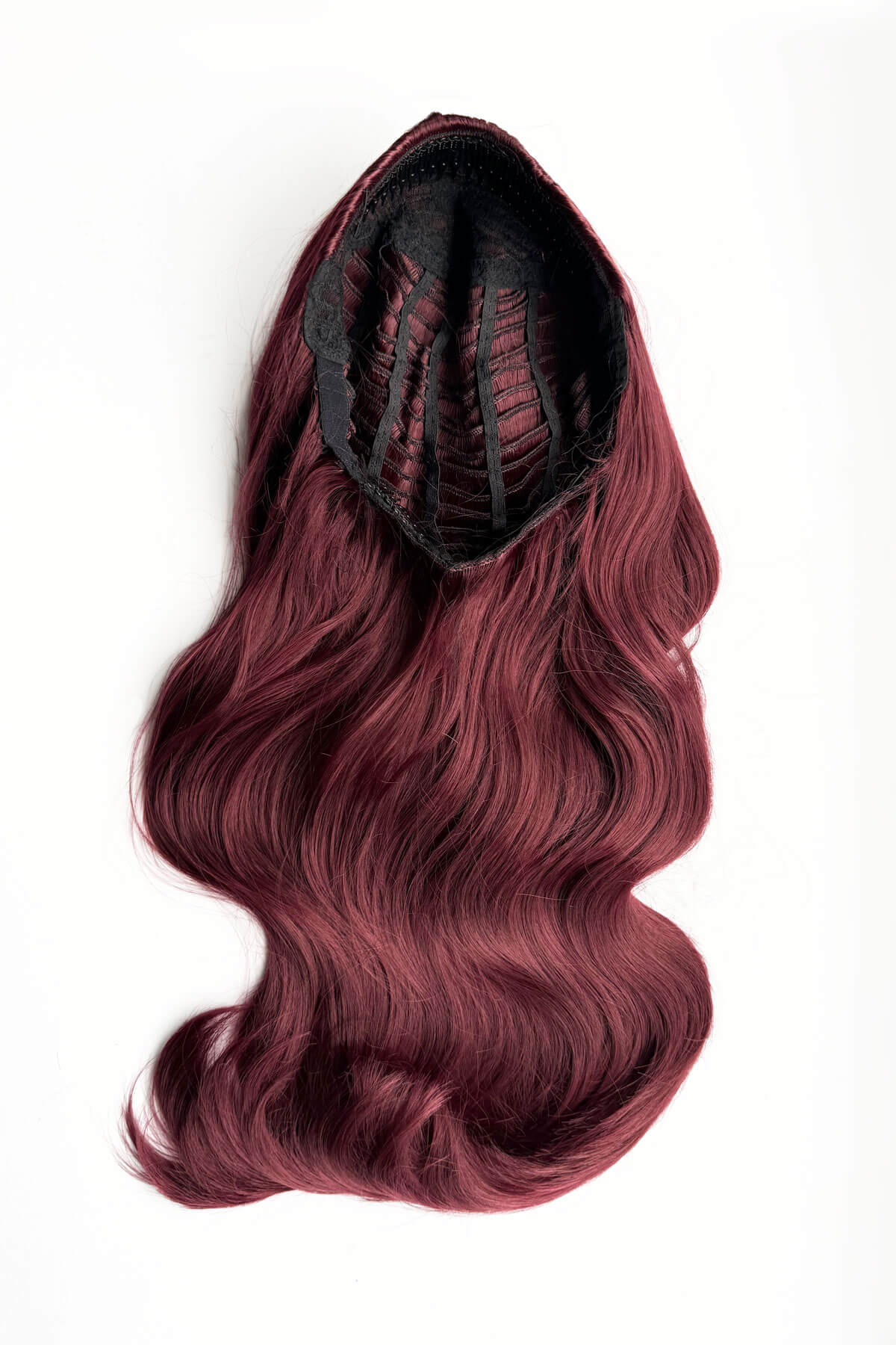 Red hair extension on a white background. Heat styleable half wig hairpiece, long wavy, Flexihair: Antoinette cherry red 39
