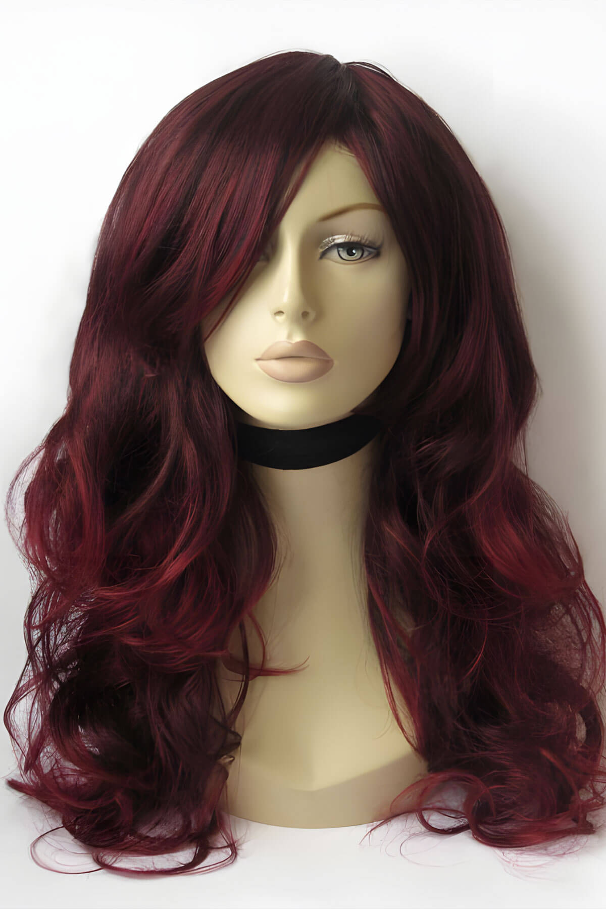Mannequin head with burgundy wig on a white background. Long red and black wig: Cheryl