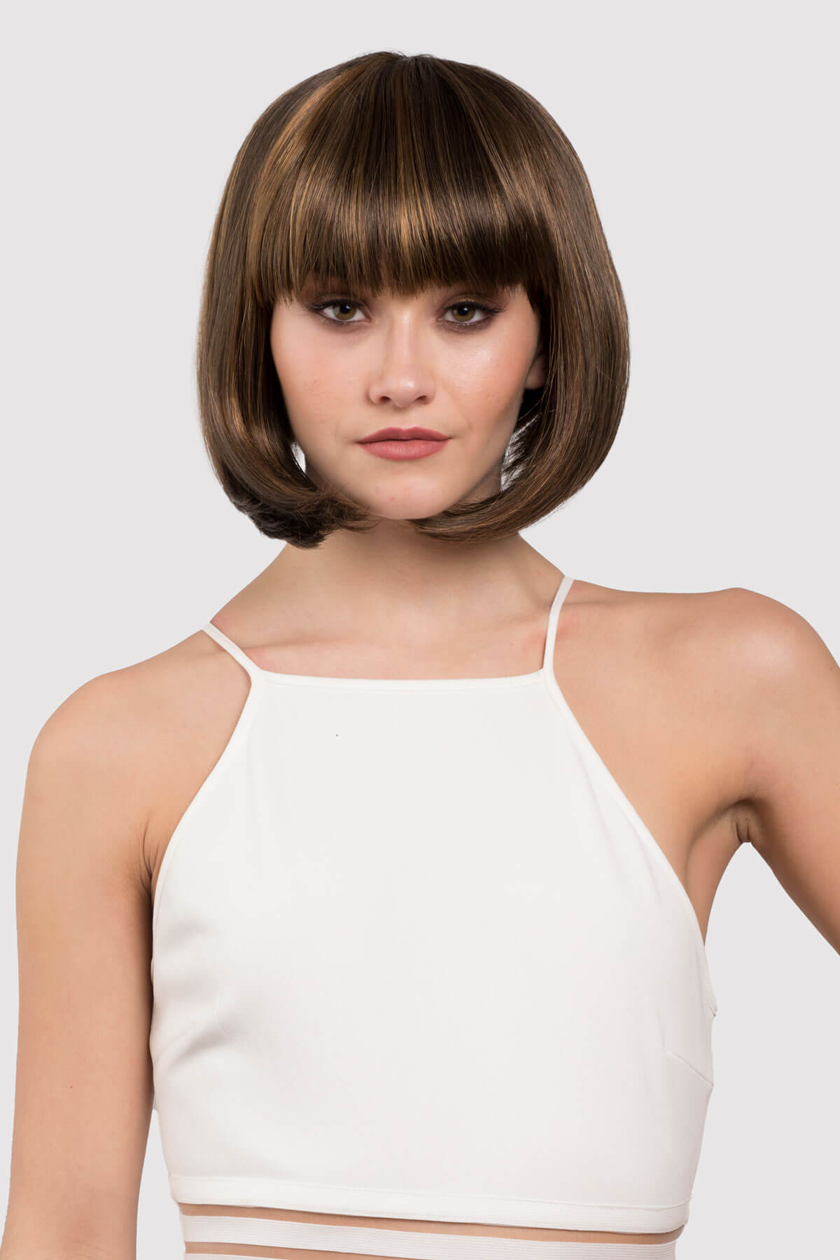 woman wearing a brown wig with blonde highlights. Chocolate brown inverted bob wig with blonde highlights: Keira