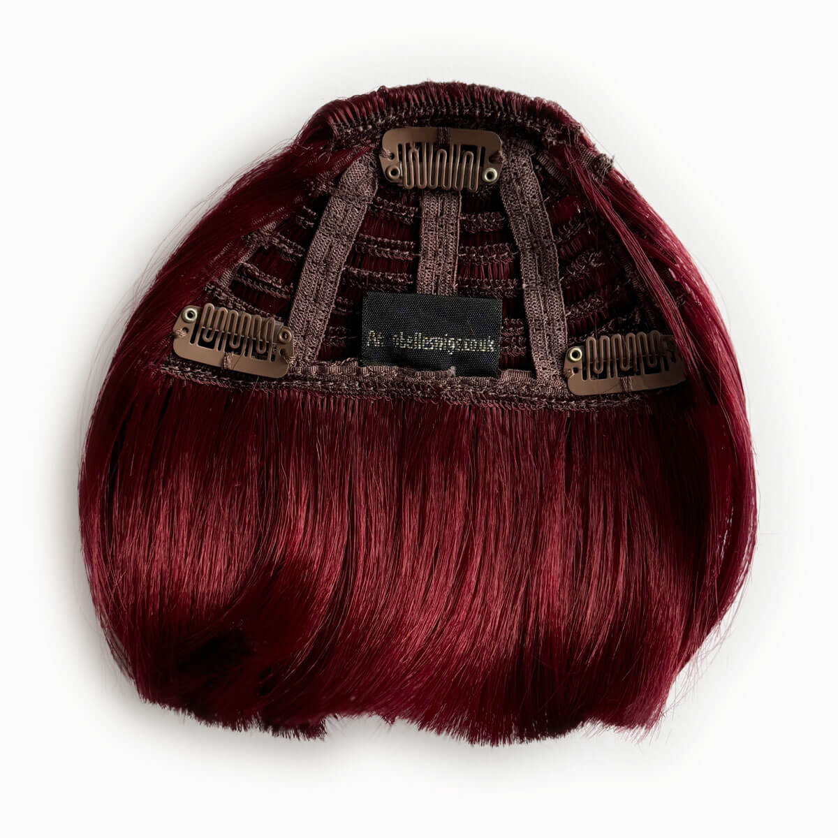 Red hair extension on a white background. Clip-in fringe hairpiece/clip-in micro-bangs, thick, straight retro rockabilly style: Ida cherry red 39