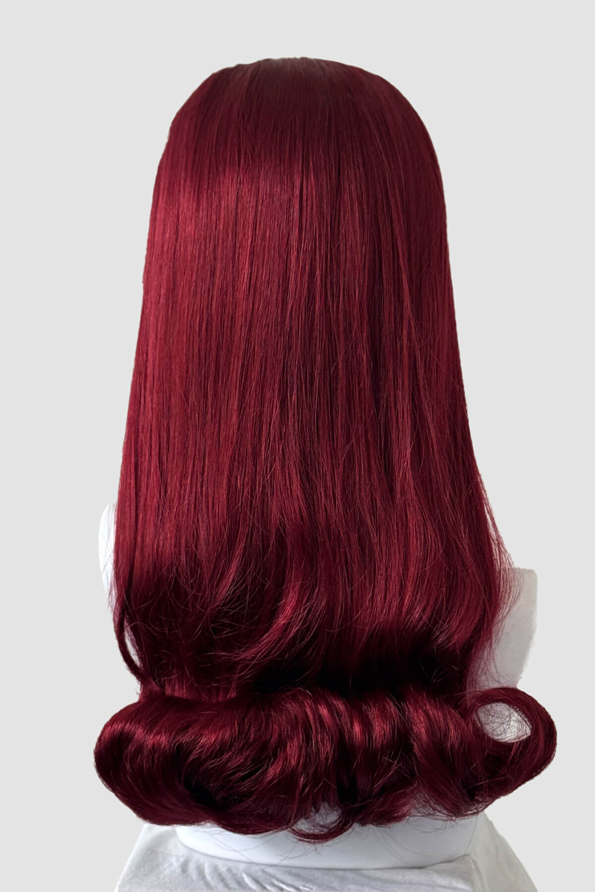 Red wig on a white background. 1960s Retro high crown, half wig hairpiece, long with hair flip: Priscilla cherry red 39