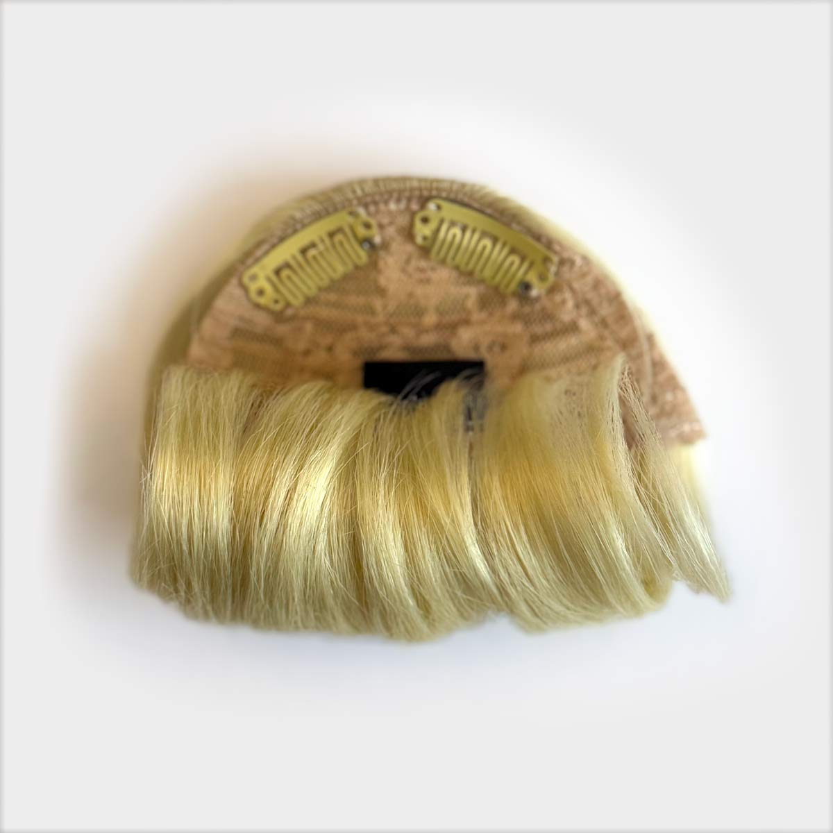 Blonde hair extension on a white background. Victory roll fringe/bangs hairpiece, 1950s vintage style: Rosa light blonde 613