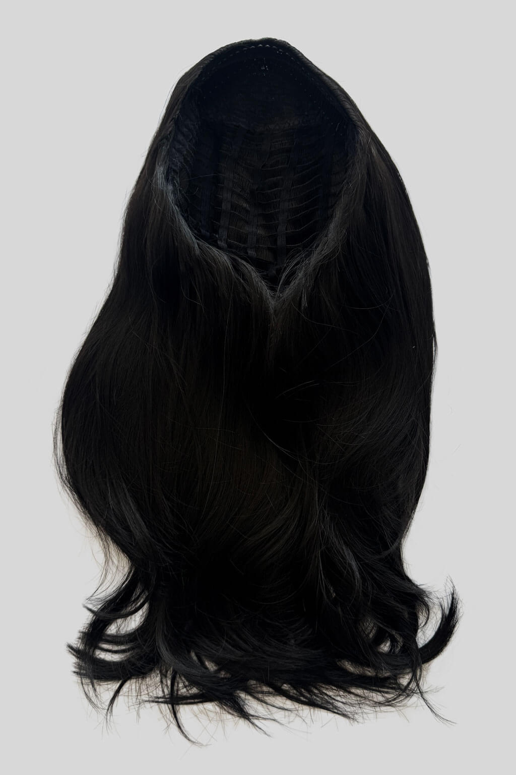 Black wig on a white background. 1960s style hair, high crown long straight and layered half wig: Juliette black 1b