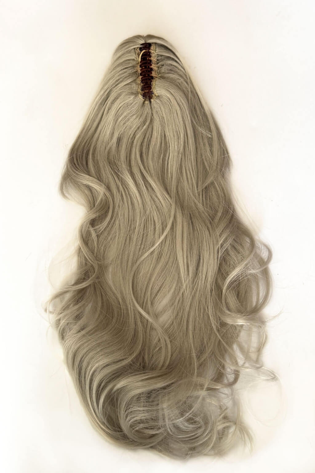 A long, wavy synthetic ponytail wig, against a plain off-white background. Clip-in ponytail hairpiece extension: Olivia silver 60