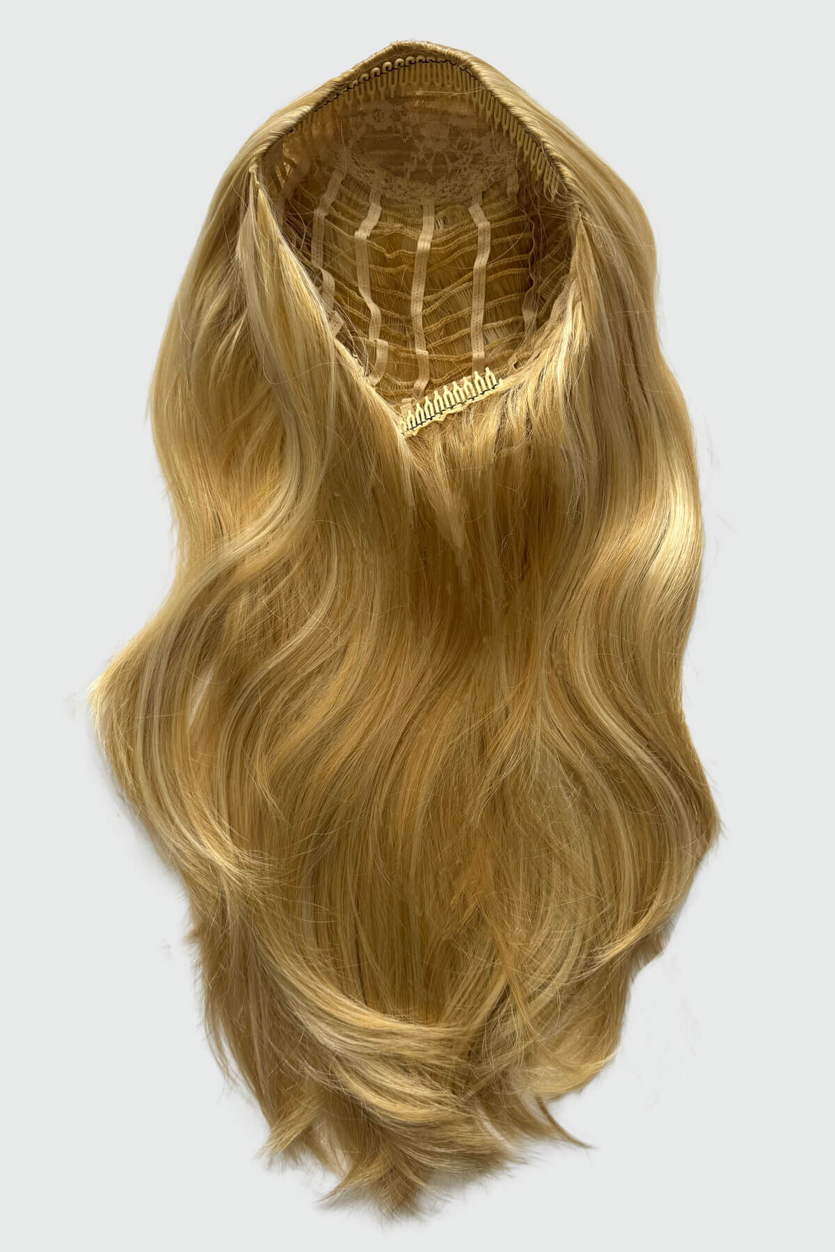 Blonde hair extension on a white background. Straight blonde half wig hairpiece (3/4 wig), layered: Autumn blonde 24BH613