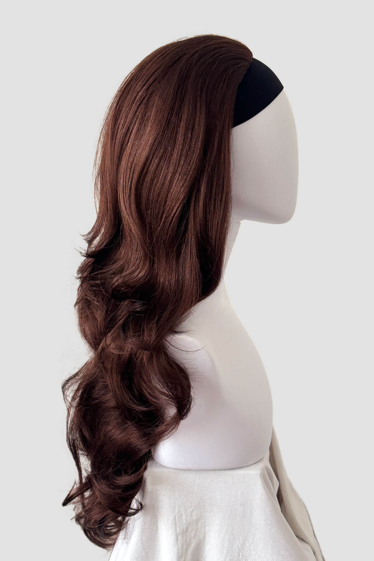 Mannequin head with long brown wig on a white background. Anne - Super Full Volume Long Loose Curls Reddish Brown Half Wig