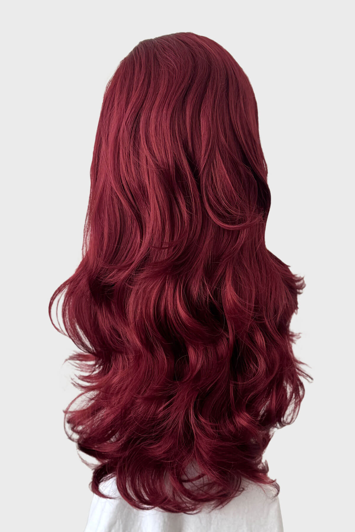Mannequin head with long red wig and black headband on a white background. Red 3/4 wig hairpiece (half wig), big loose curls: Marie