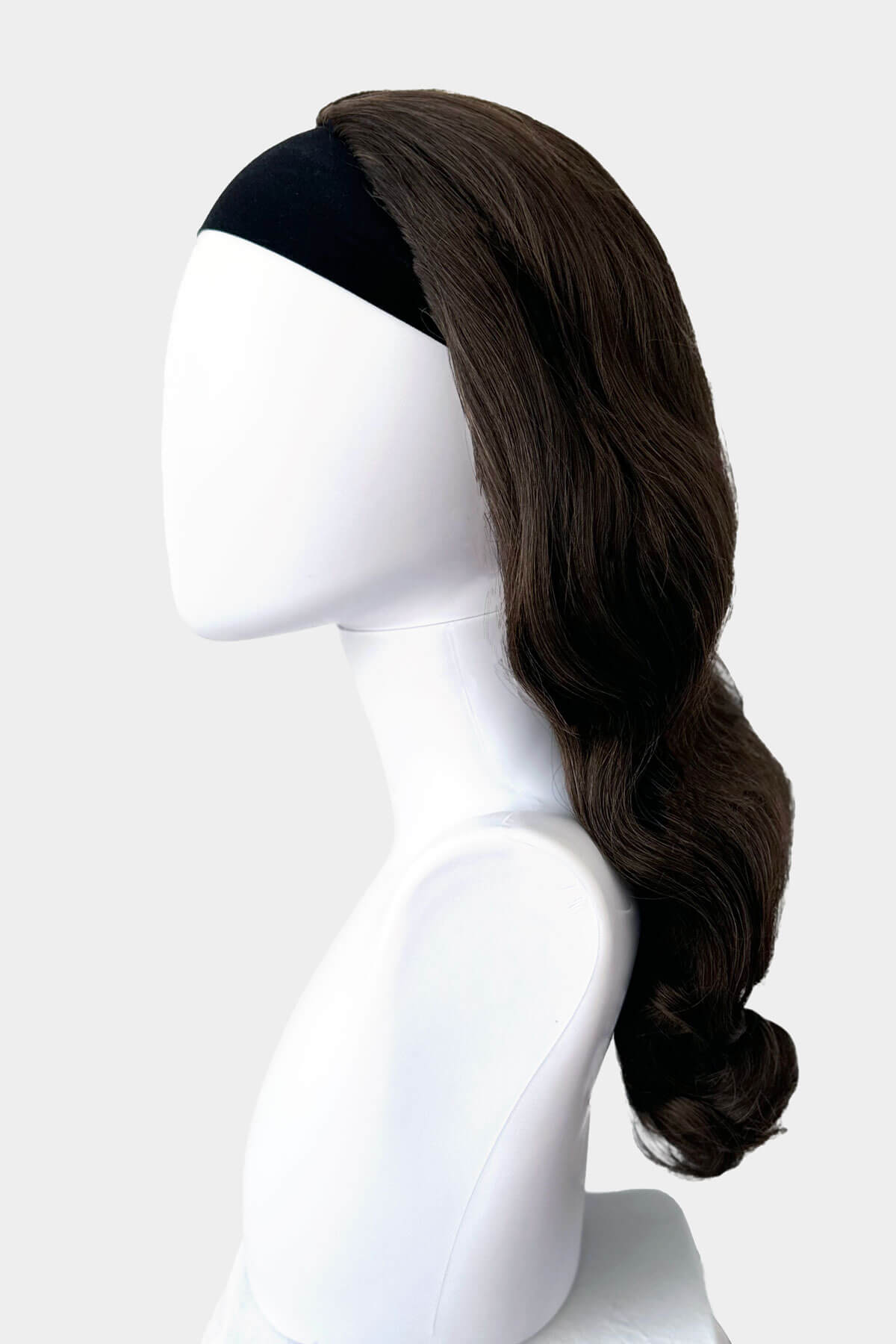Chestnut brown wig on a mannequin head against a white background. 1950s style half wig hairpiece with beautiful waves: Morgana chestnut brown 8
