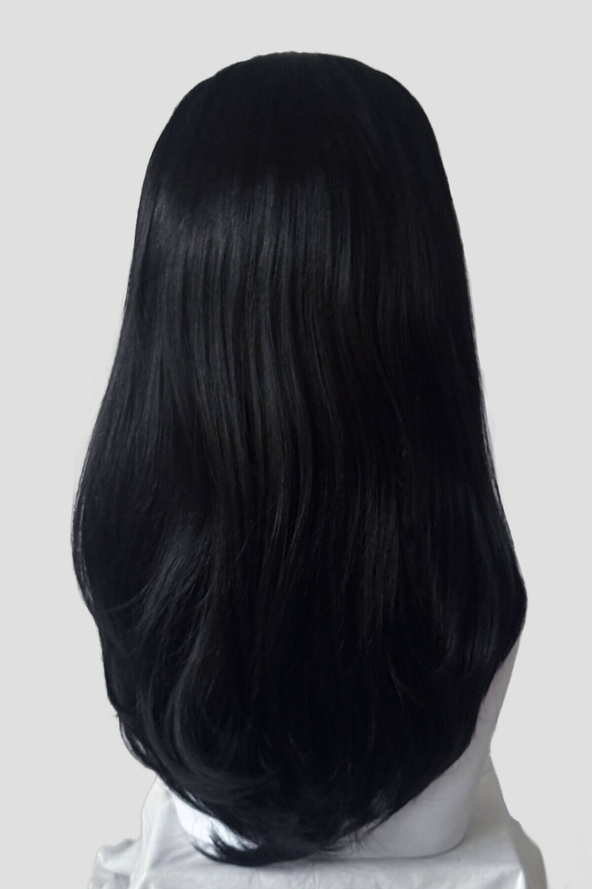 Black wig on a mannequin head against a plain background. Headband half wig hairpiece, long and straight: Isla black 1B