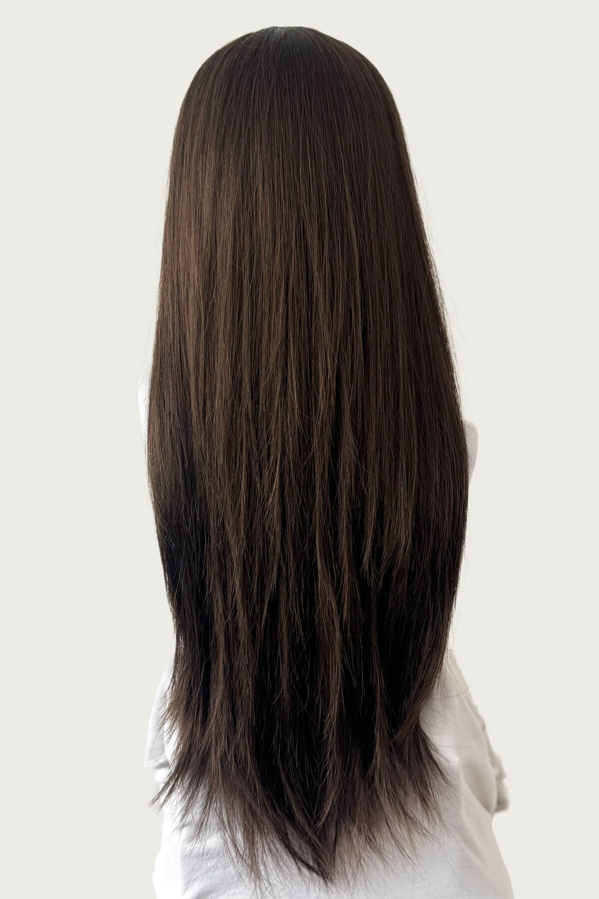 Person with long, straight brown hair on a plain background. Straight brown half wig hairpiece extension, long: Faye chestnut brown 8