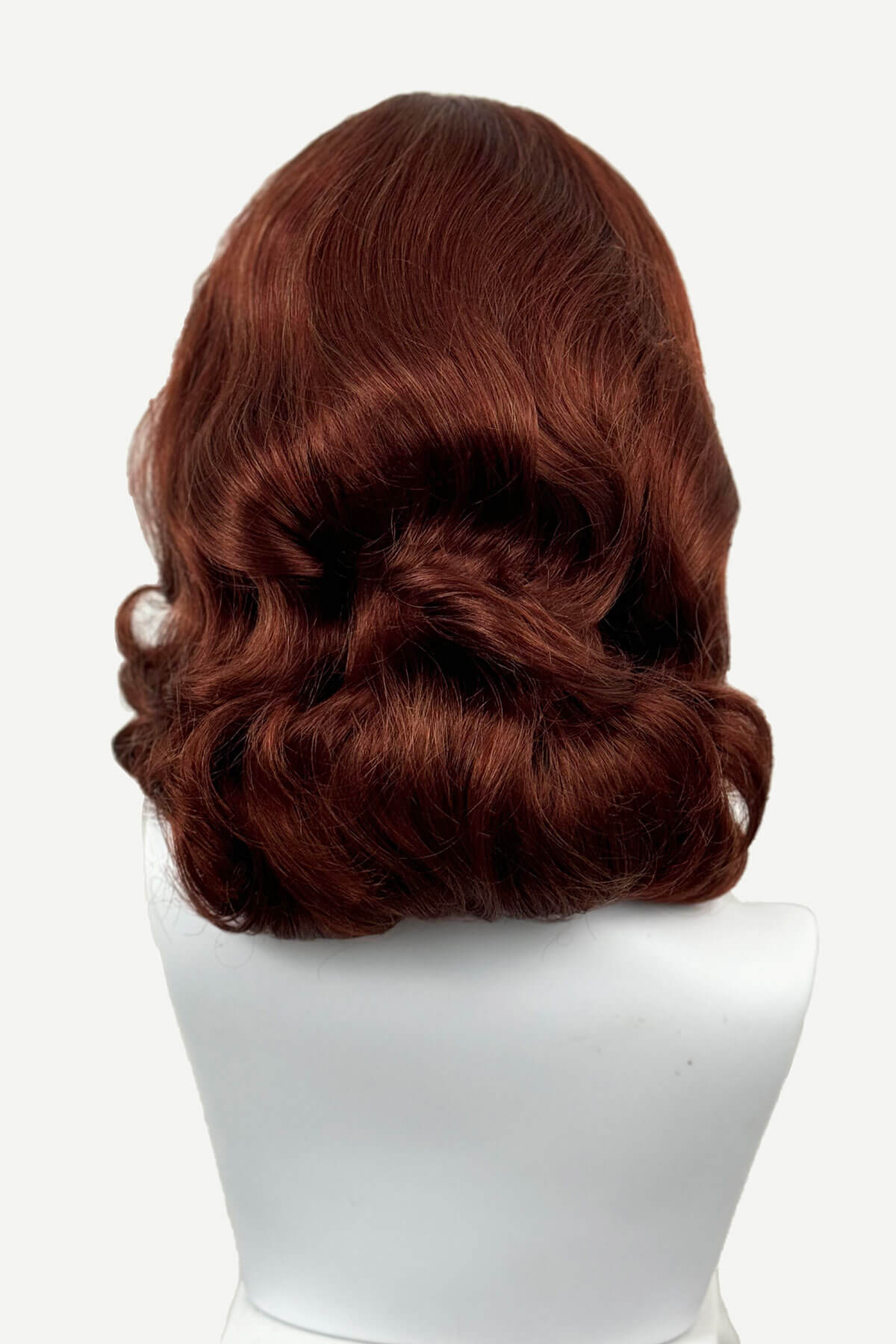 Brown wig on a white mannequin head against a white background, viewed from the back. 1950s style shoulder length half wig hairpiece with beautiful vintage waves: Onyx copper red 130