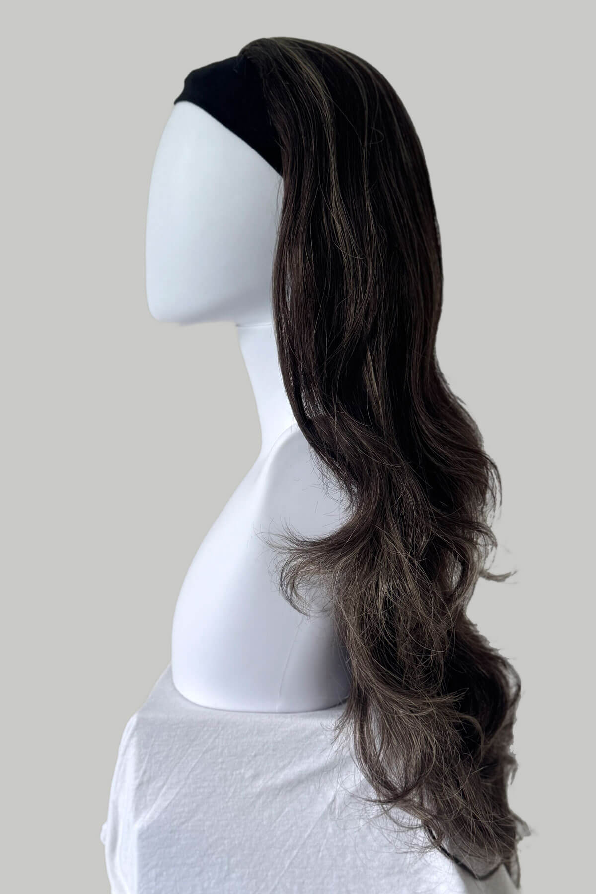 Brown wig on a mannequin head against a plain background. Brown half wig with blonde highlights: Reese 6H24