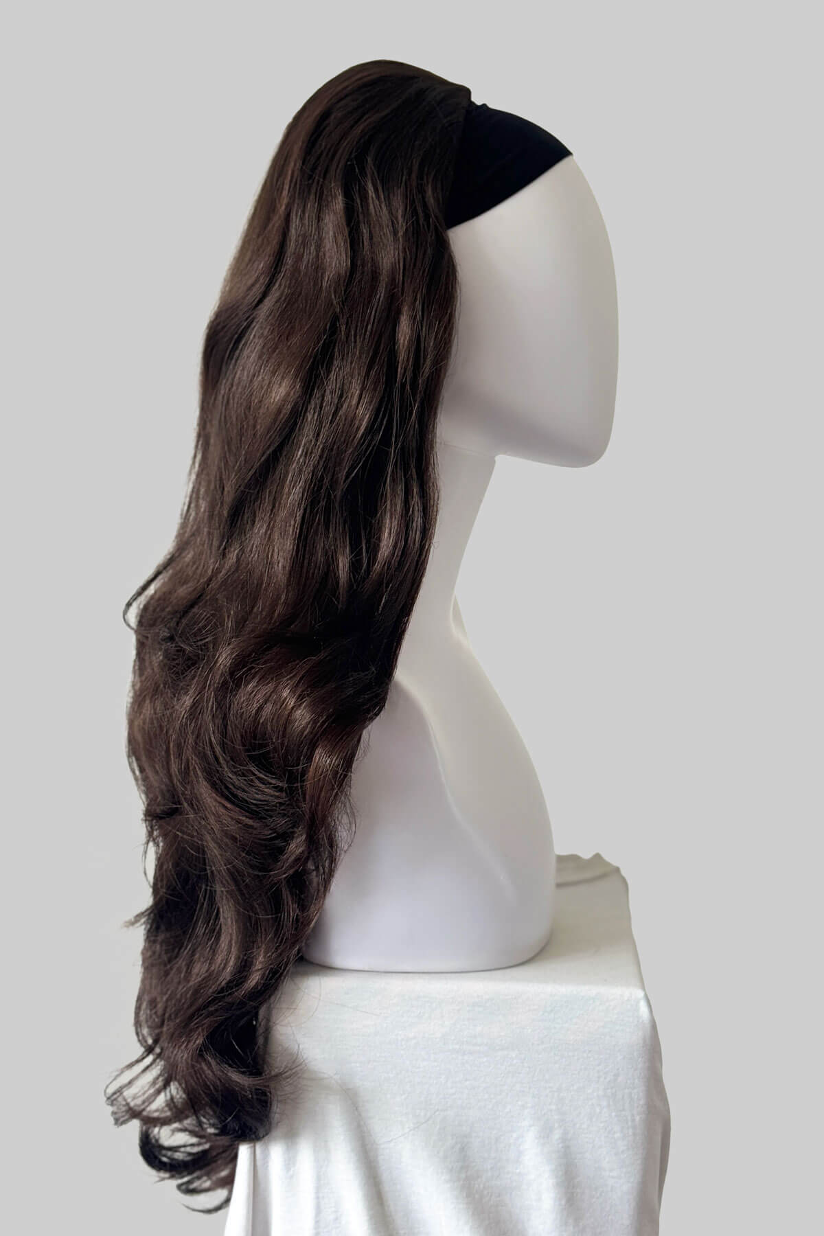 Long, dark reddish brown wavy wig displayed on a white mannequin head and shoulders against a grey background. Corrine - Bouncy Blowout style with Volume Booster Half Wig dark reddish brown 6/33