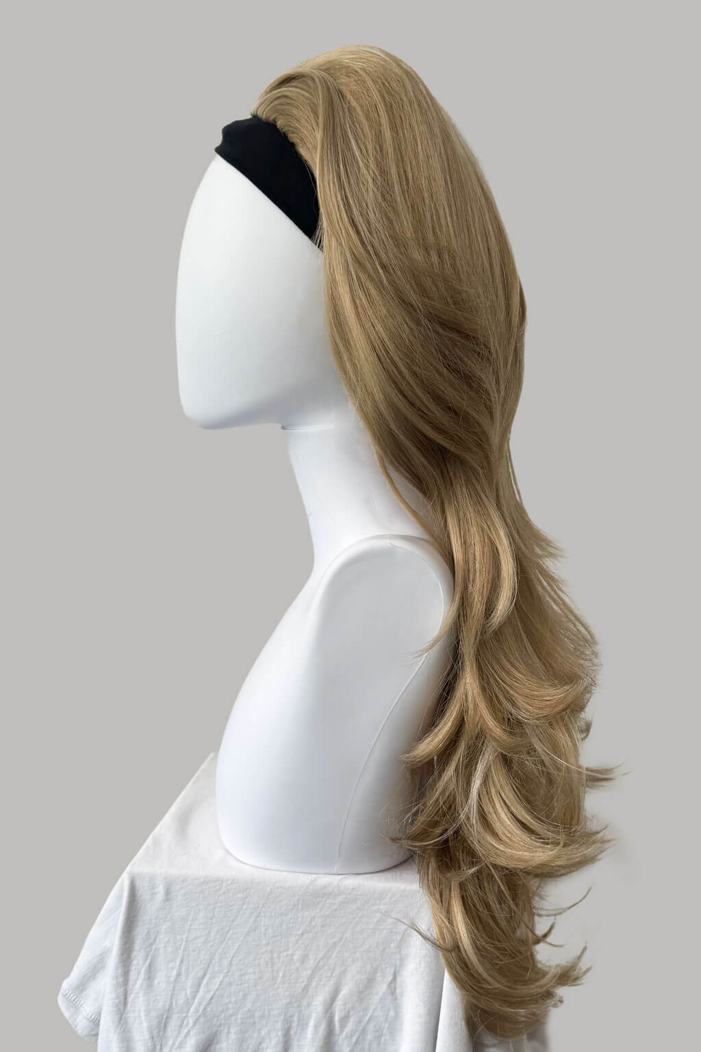 Blonde wig on a mannequin head against a gray background - High crown long, layered half wig and volume ring: Helena blonde 24H613