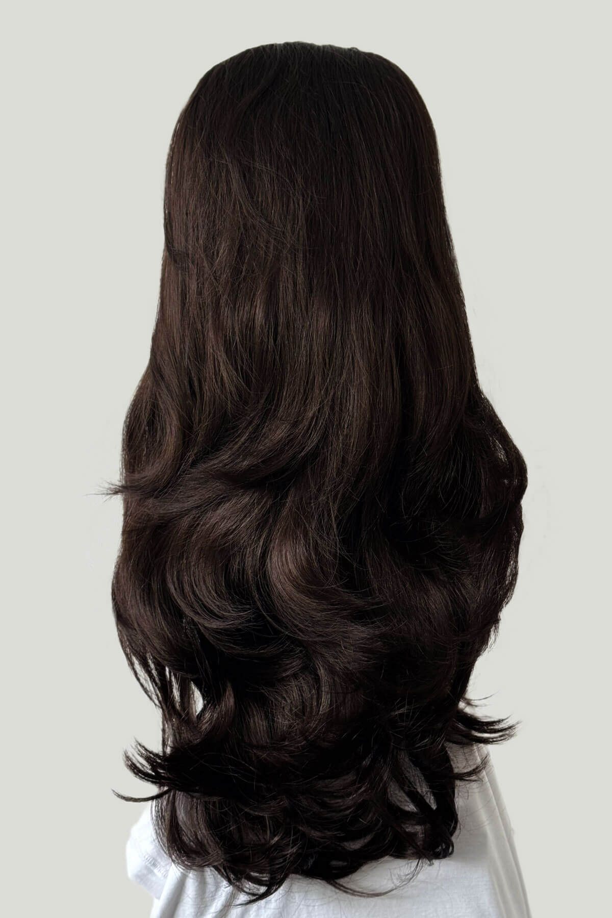 Long, dark brown wig on a plain background. High crown long, layered half wig and volume ring: Helena dark chocolate brown 6