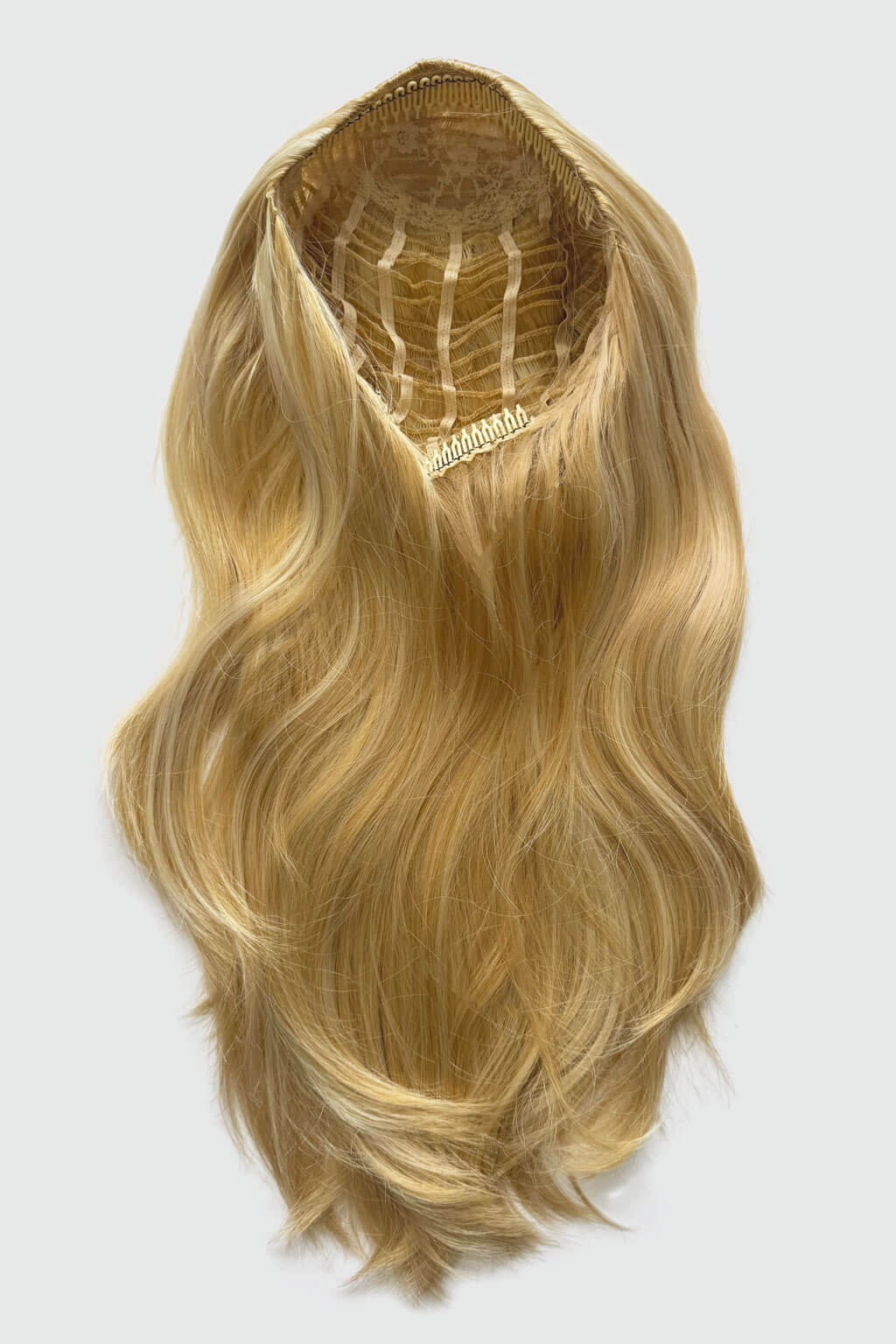 Blonde hair extension on a white background. 1960s style hair, high crown long straight and layered half wig: Juliette golden blonde 24BH613