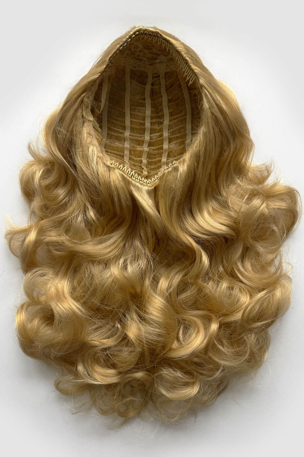 Blonde wig with a white background. Curly blonde half wig hairpiece extension (3/4 wig), long: Meana honey blonde 24BH613
