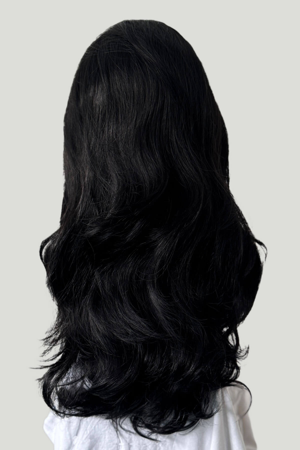 Black wig on a white background. Black 3/4 hairpiece (half wig) with long waves: Jessie black 1b