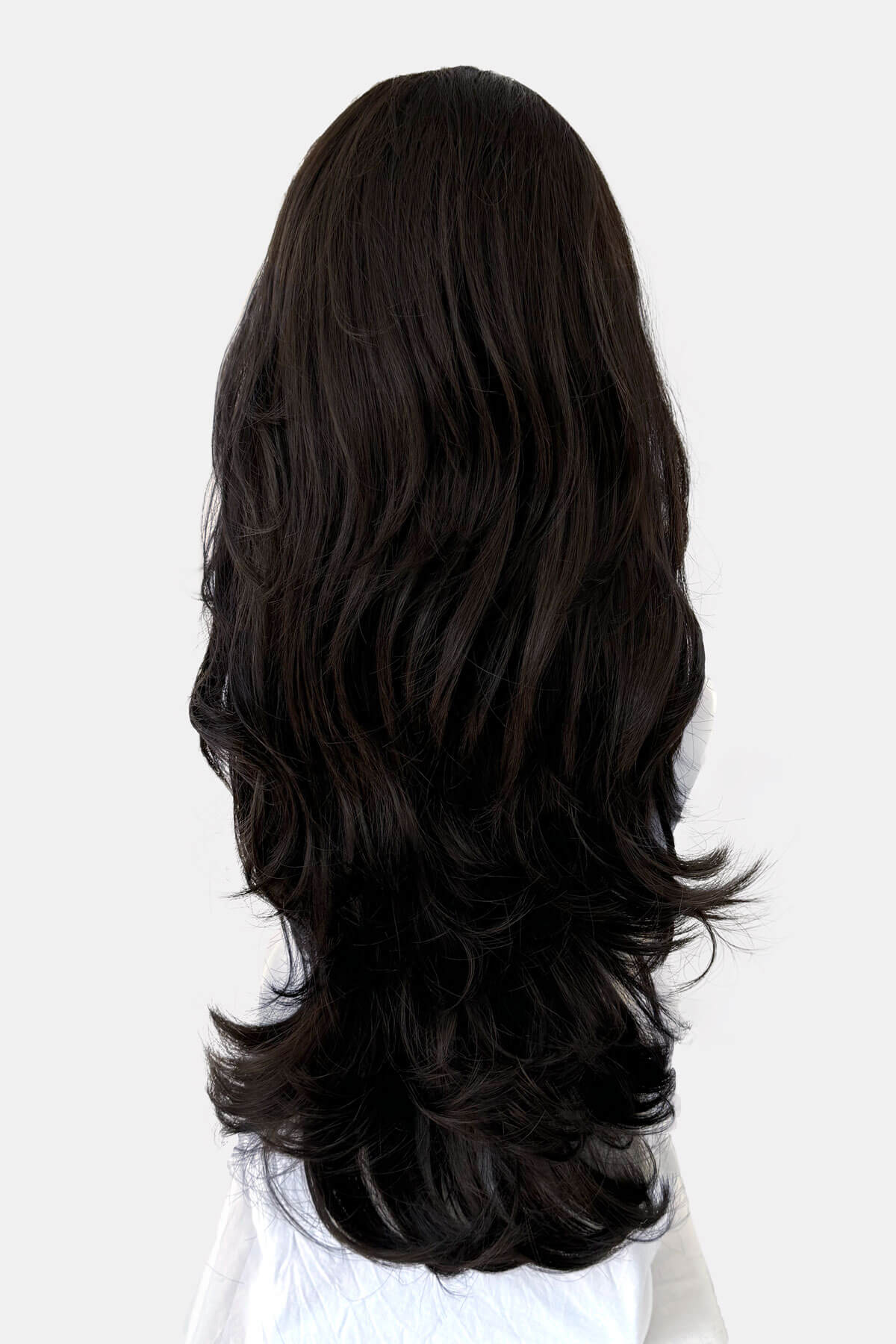 Black wig with long, wavy hair on a white background. Brown half wig hairpiece (3/4 wig), layered, wavy: Simone dark brown 4