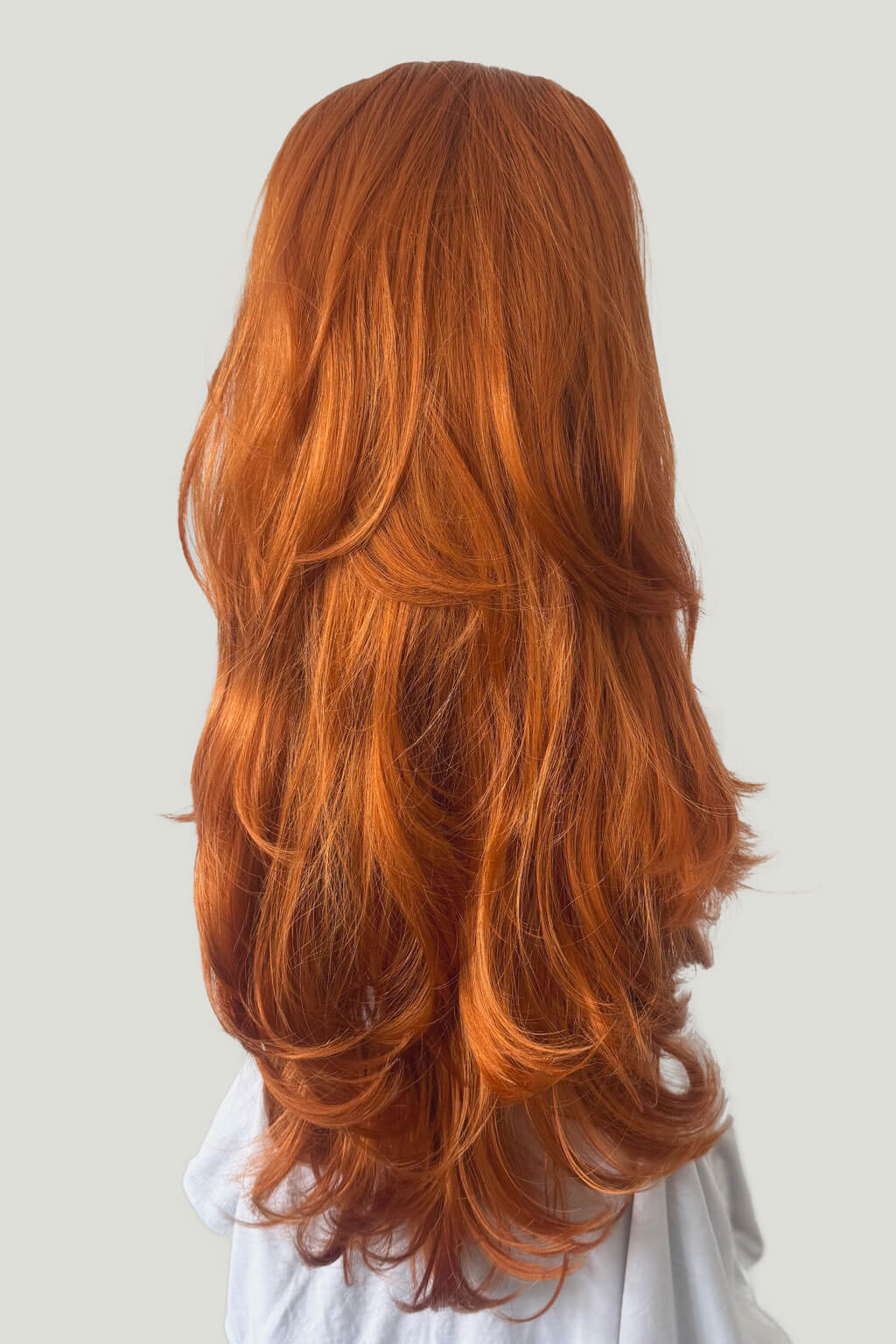 Long, wavy red hair on a plain background - High crown long, layered half wig and volume ring: Helena ginger