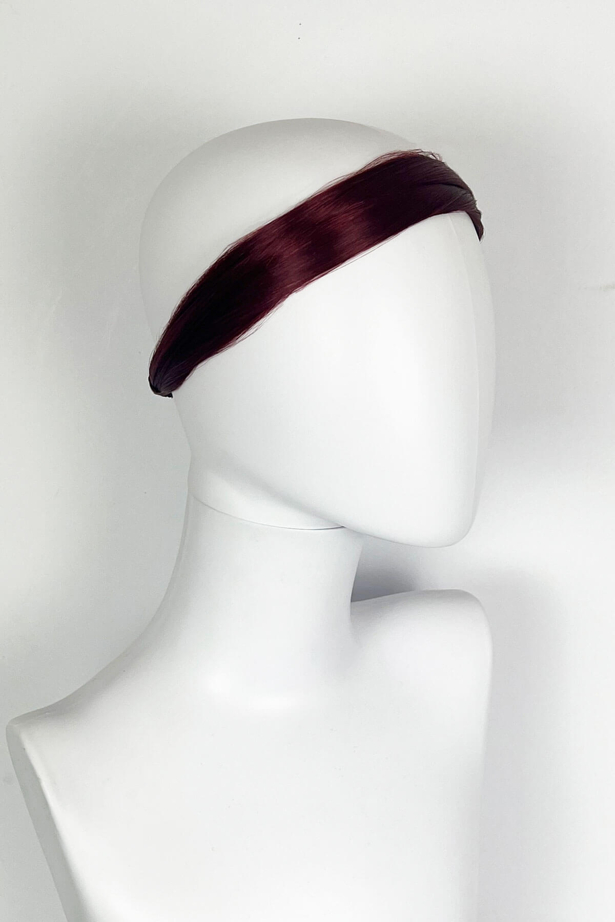 Red headband on a mannequin head against a white background. Loose hair hairband: Mabel red 39