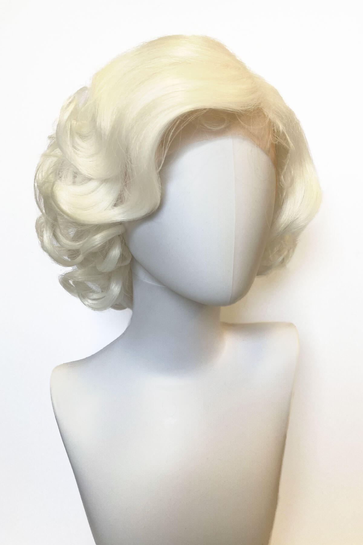 Blonde wig on a mannequin head against a white background. Blonde pinup wig, lace front, vintage style: Marilyn white platinum 1001