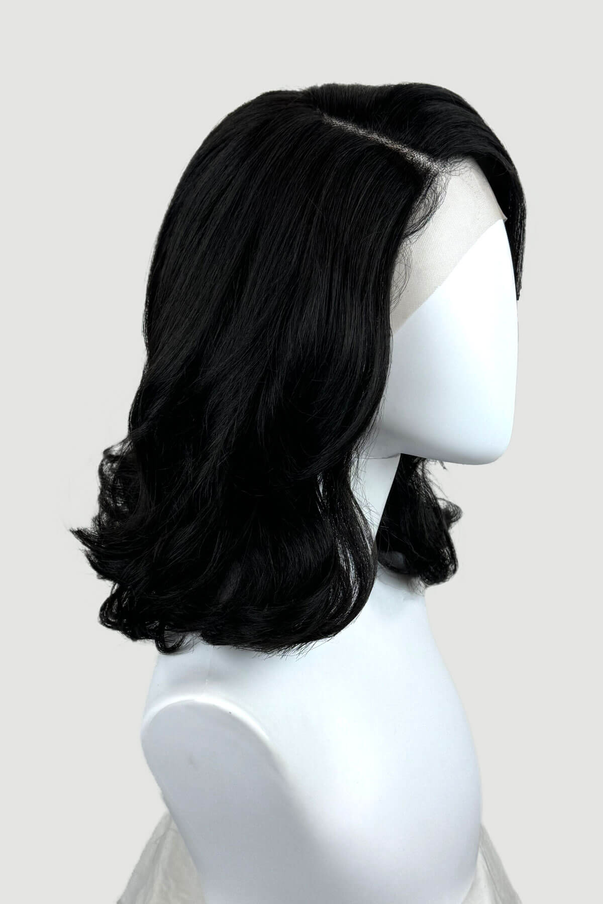 Black lacefront wig with side partingon a mannequin. Black shoulder length long bob (lob) lacefront wig with side sweeping fringe/bangs: Amaris