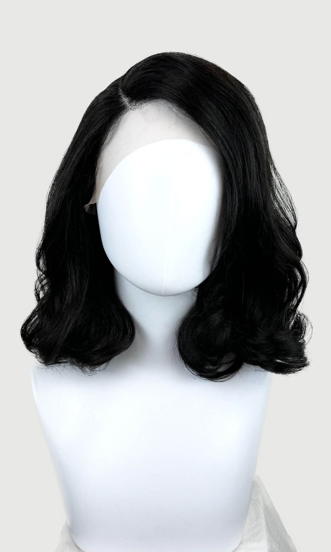 Black lacefront wig with side partingon a mannequin. Black shoulder length long bob (lob) lacefront wig with side sweeping fringe/bangs: Amaris