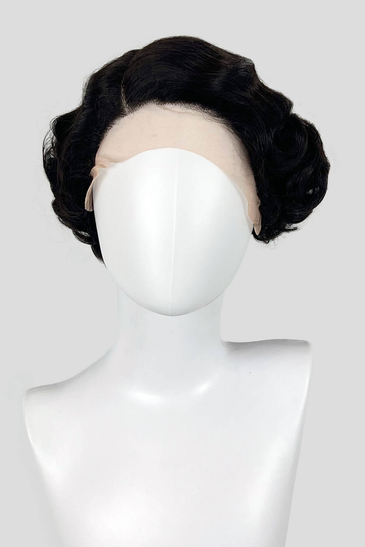 Dark brown wig on a mannequin head against a white background. Dark brown lacefront wig, pinup/vintage style, short with finger waves: Dixie