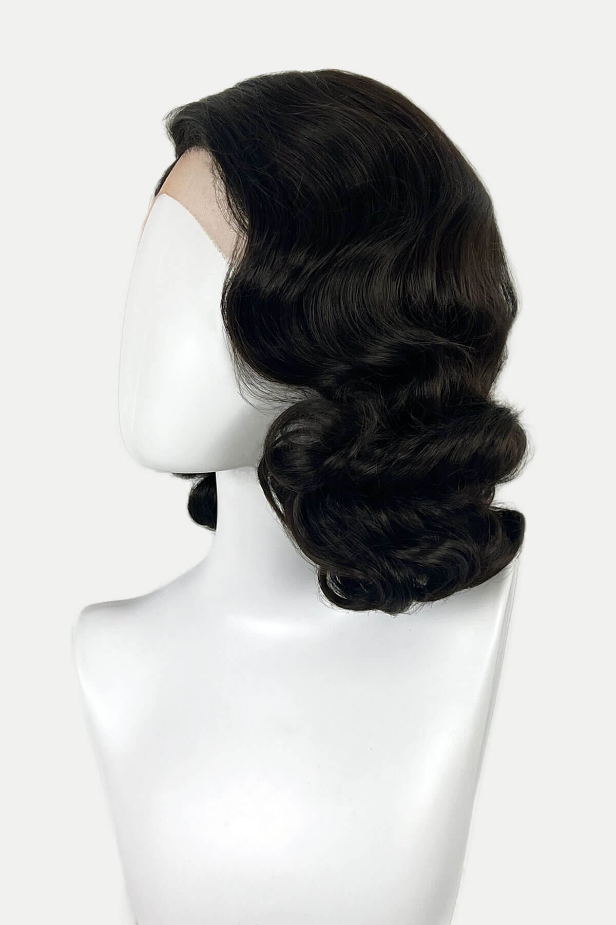 Black wig on a mannequin head against a white background. Brown lacefront wig, pinup/vintage style, mid length with finger waves: Hattie