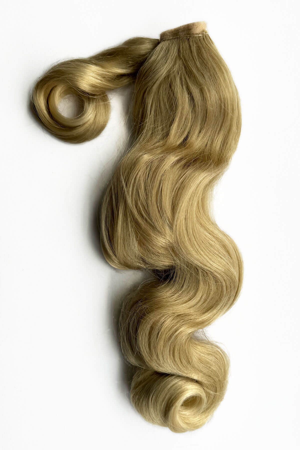 Blonde hair extensions with wavy texture on a white background. Retro style ponytail hairpiece, long with vintage waves: Arabella blonde 613T24