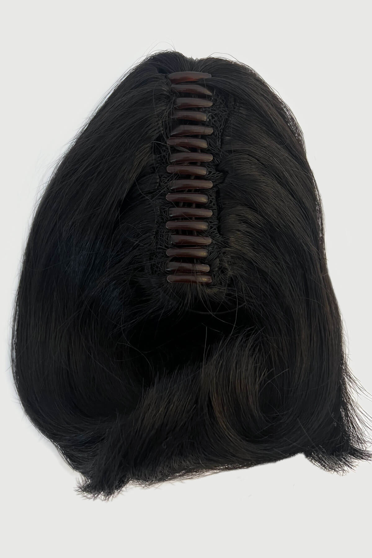 Dark brown hairpiece with a parting on a white background black 1B