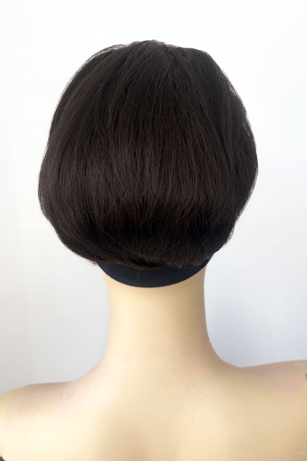 Mannequin wearing short beehive ponytail hairpiece: Sherri dark chocolate brown 6