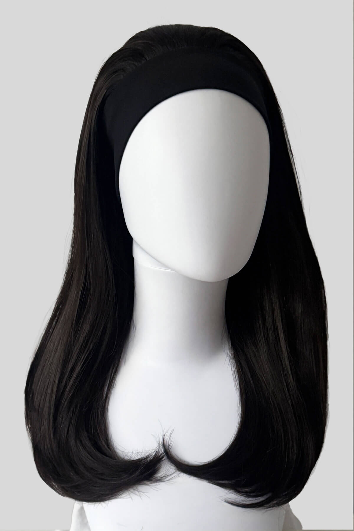 A close-up of a dark brown headband half wig hairpiece showing the texture of the hair against a white background. Headband half wig hairpiece, long and straight: Isla dark brown 4