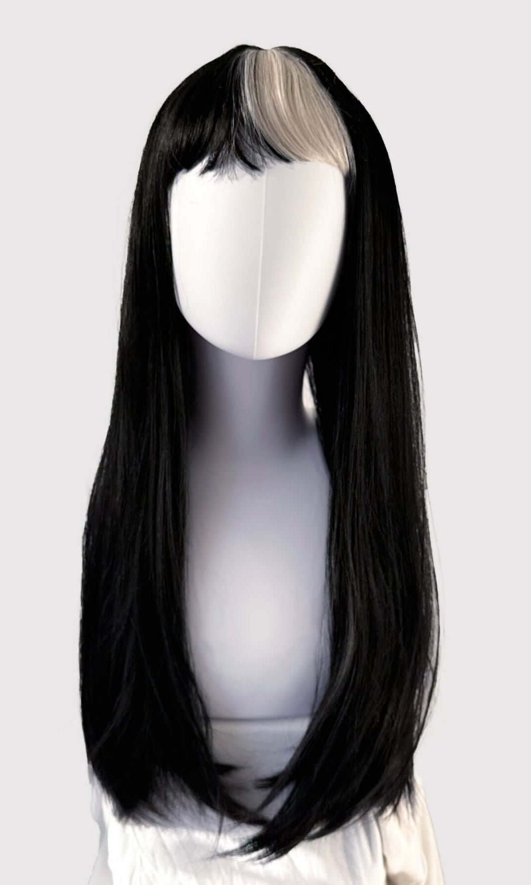Black wig with a clip-in extension on a mannequin head against a white background. Long, black, straight wig with platinum fringe streak and retro, straight fringe: Imogen