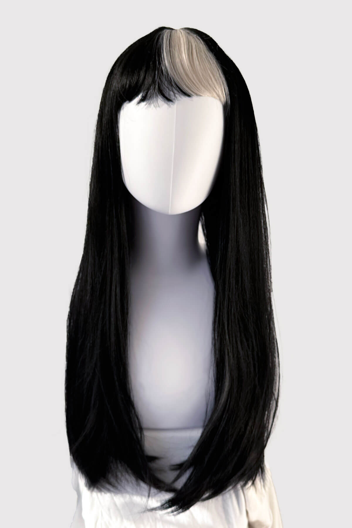 Black wig with a clip-in extension on a mannequin head against a white background. Long, black, straight wig with platinum fringe streak and retro, straight fringe: Imogen