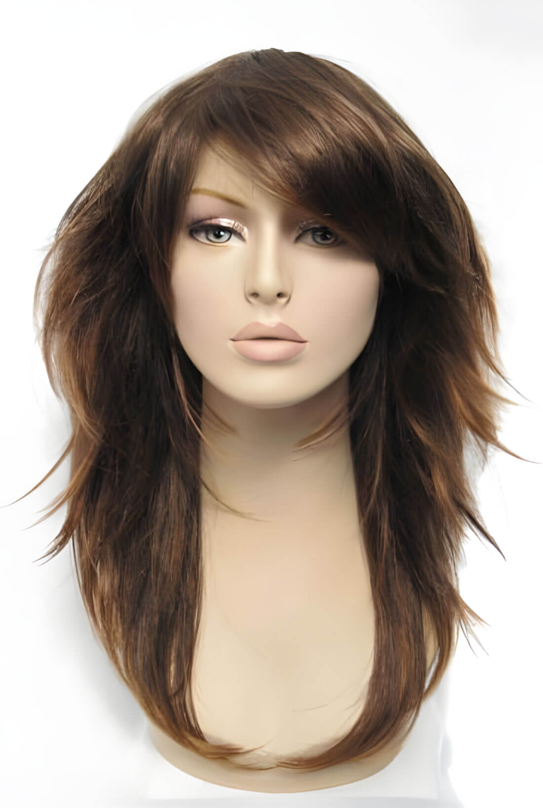 Brown wig on a mannequin head against a white background. Long warm brown wig, layered, flicked tips: Selina
