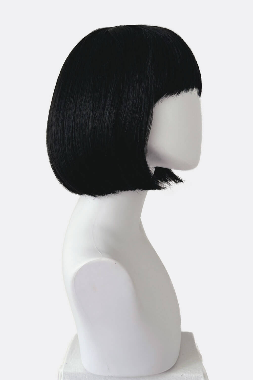 Black bob wig on a white mannequin head against a white background. Short black bob wig: Josie
