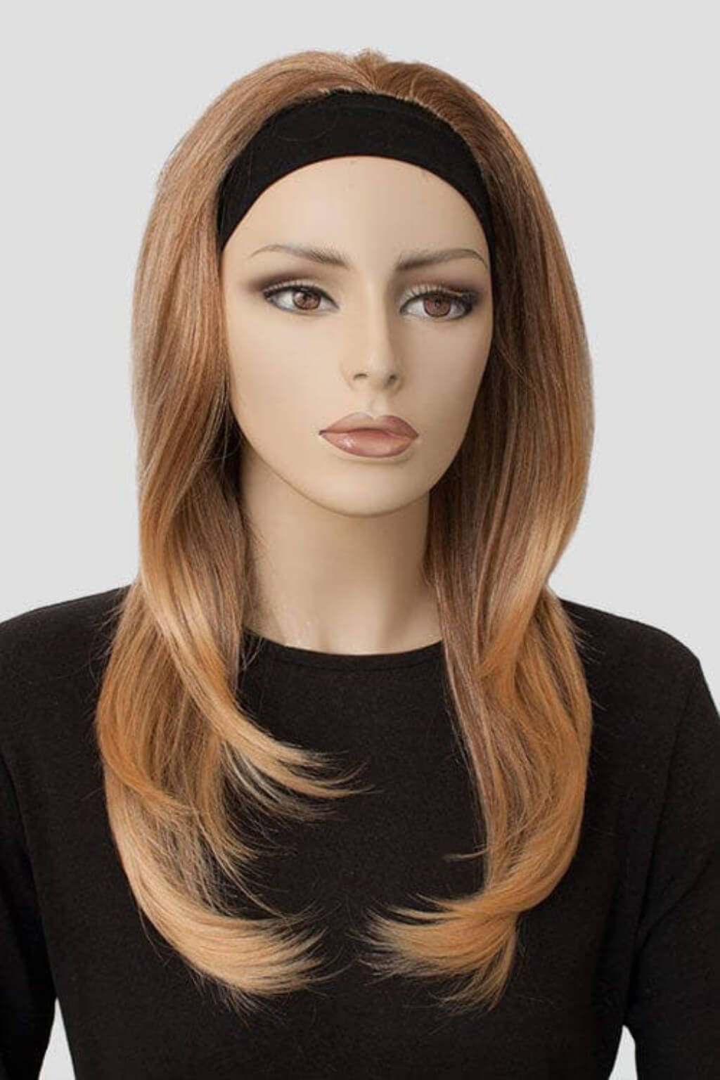 Mannequin head with a brown wig on a white background. Brown half wig hairpiece (3/4 wig), gently layered: Briar