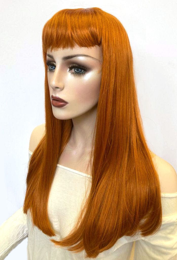 Long ginger wig with straight hair and a short, straight fringe: Daphne AnnabellesWigs