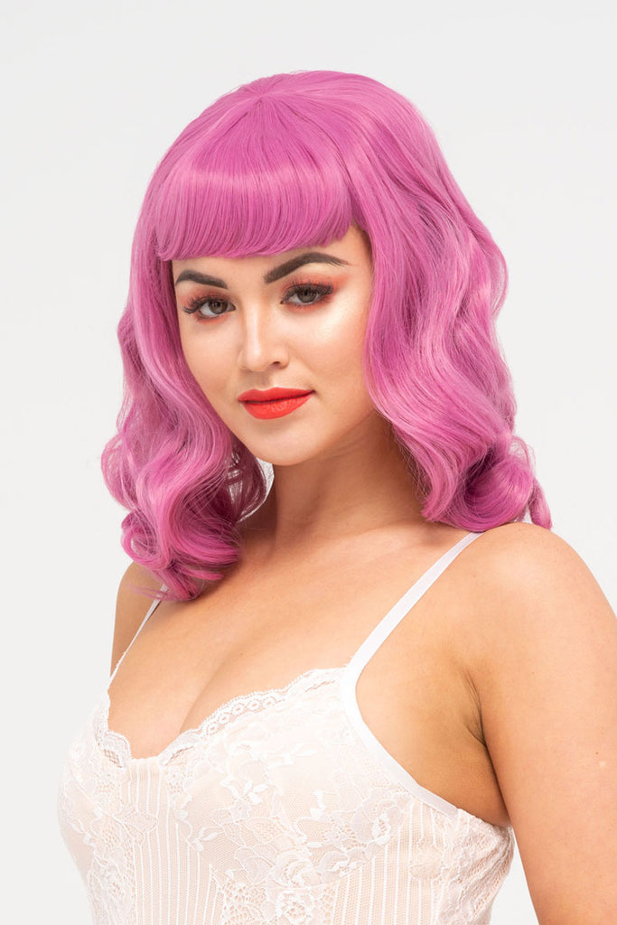 Pink pinup style wig, with finger waves and a short fringe, 1950s style: Stevie