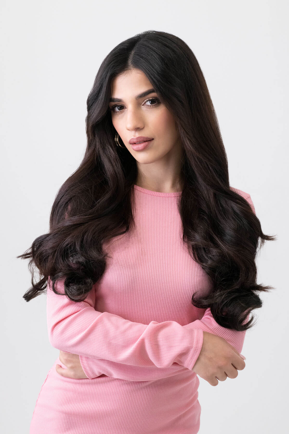 Woman wearing a pink dress against a light gray background. synthetic hair extension, 1 piece, wavy, 20", 200g dark brown 4
