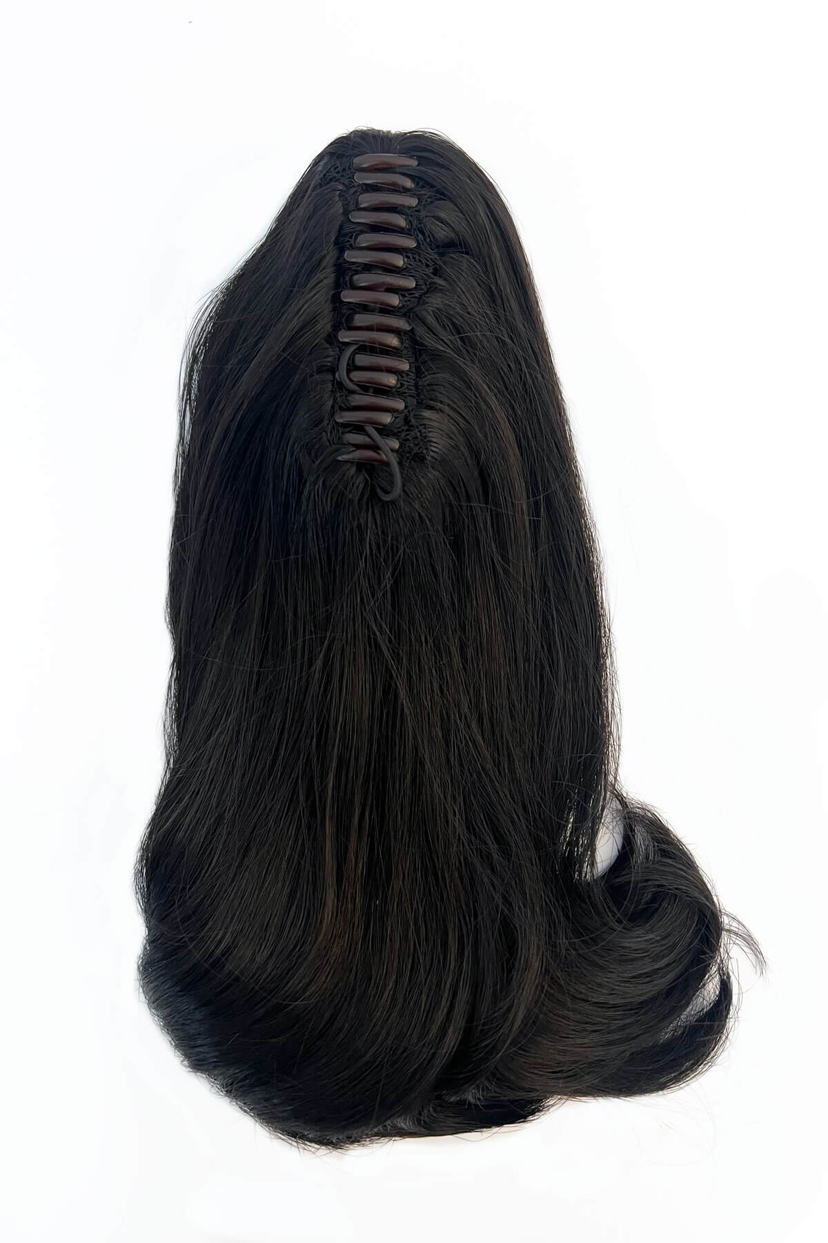 Black hair extension with a clip on a white background. Ponytail hairpiece, shoulder length with flick/flip, retro 1960s style: Ariana black 1B