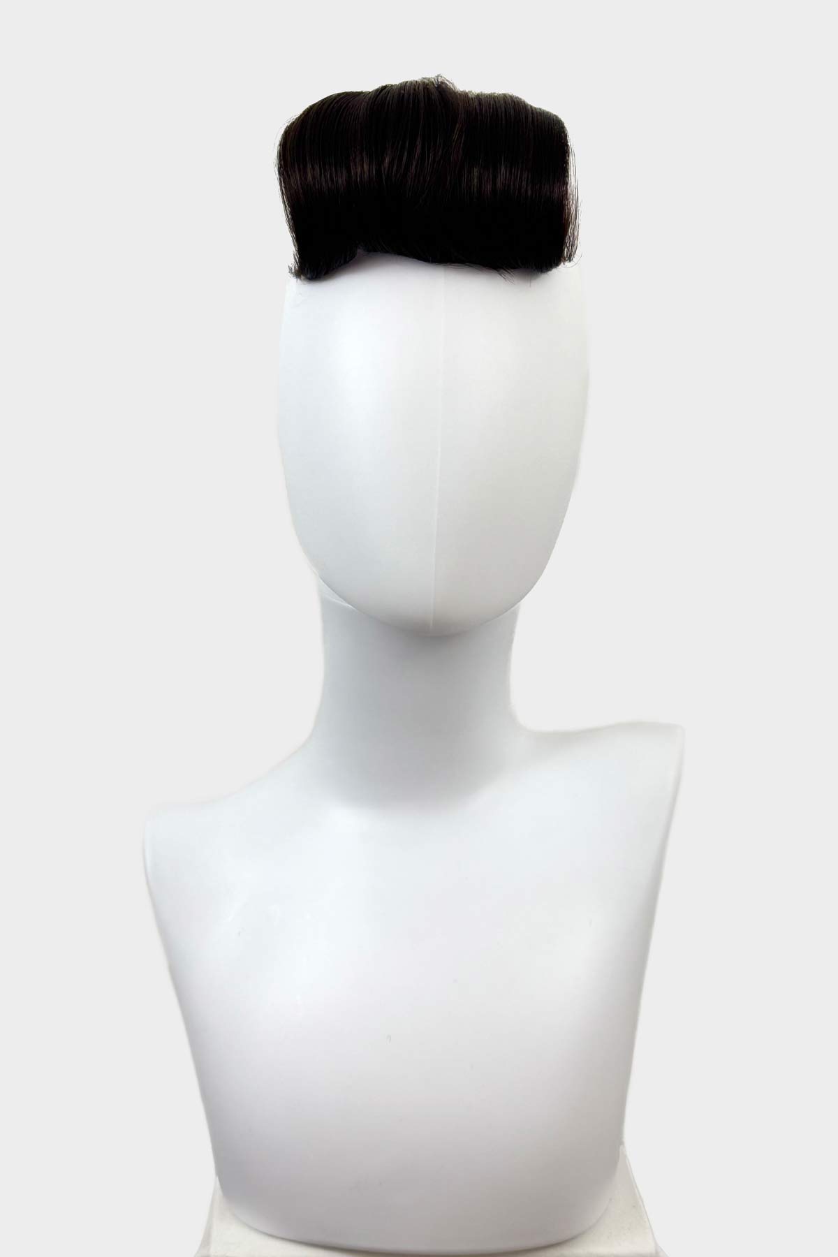 Black hairpiece on a white mannequin head against a white background. Victory roll fringe/bangs hairpiece, 1950s vintage style: Rosa dark brown 4