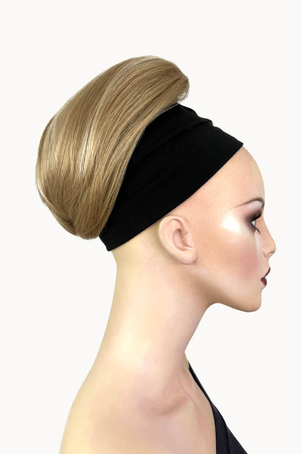 Black headband with blonde hair bun on a mannequin head against a white background. Short ponytail extension hairpiece, straight, full & bouncy: Tanaya blonde 24H613