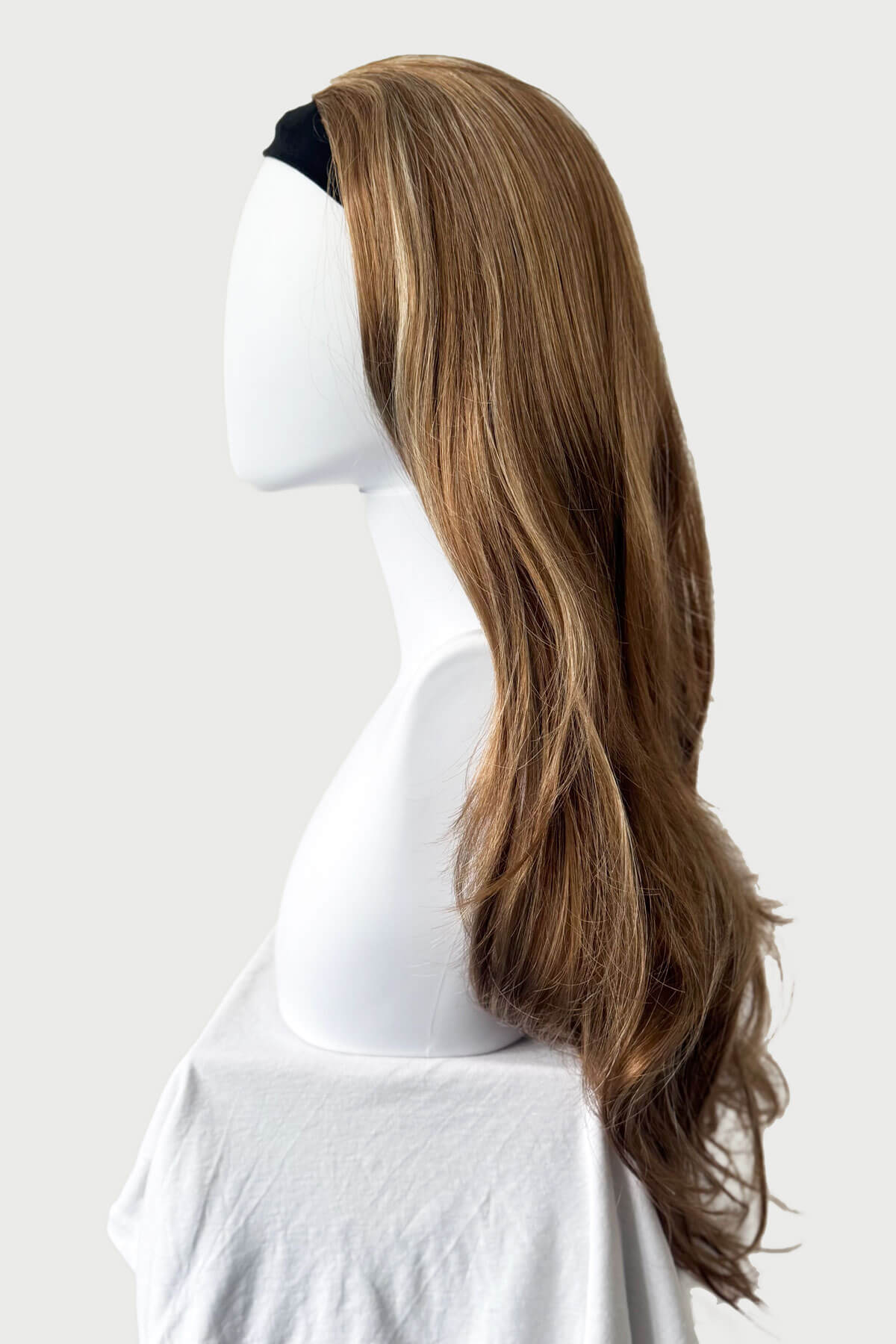 Mannequin with long brown and blonde wig. Light brown half wig with blonde highlights & loose waves: May