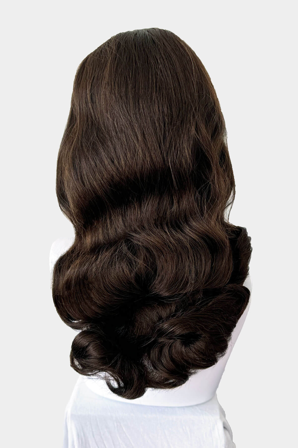 Chestnut brown wig on a mannequin head against a white background. 1950s style half wig hairpiece with beautiful waves: Morgana chestnut brown 8