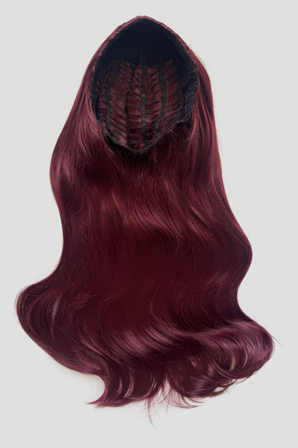 Red wig with a black spider-like design on a white background. Heat Styleable Extra Long, Gentle Wave Half Wig  red 39