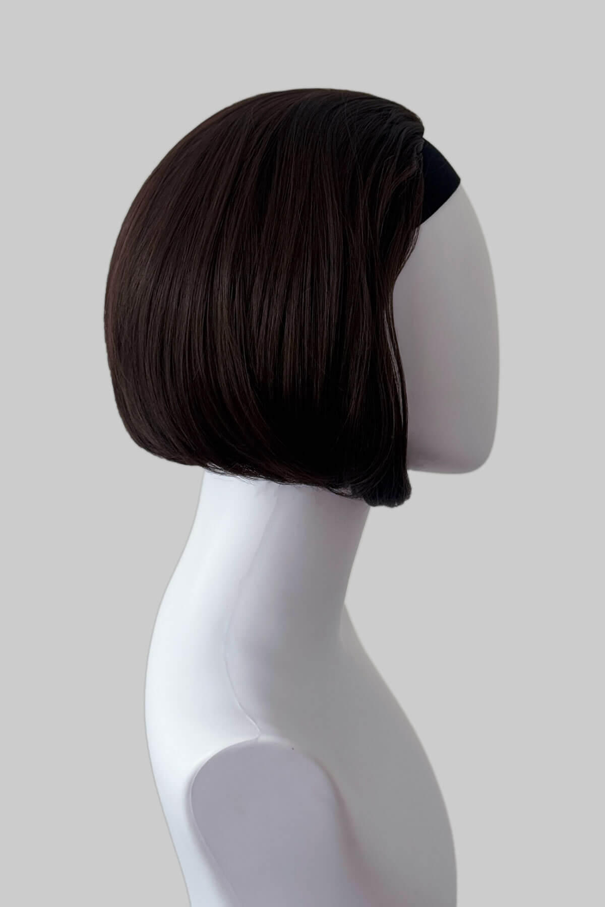Dark brown bob  half wig on a mannequin head against a plain background. Bob half wig hairpiece, Flexihair: Amelie chocolate brown 6