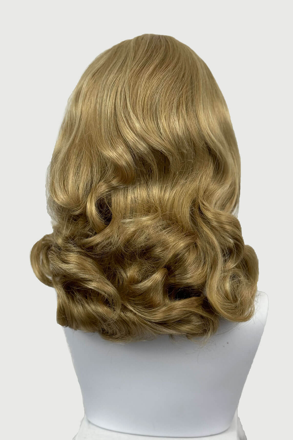 Blonde wig on a mannequin head against a white background shown from the back. 1950s style shoulder length half wig hairpiece with beautiful vintage waves: Onyx blonde 24H613 